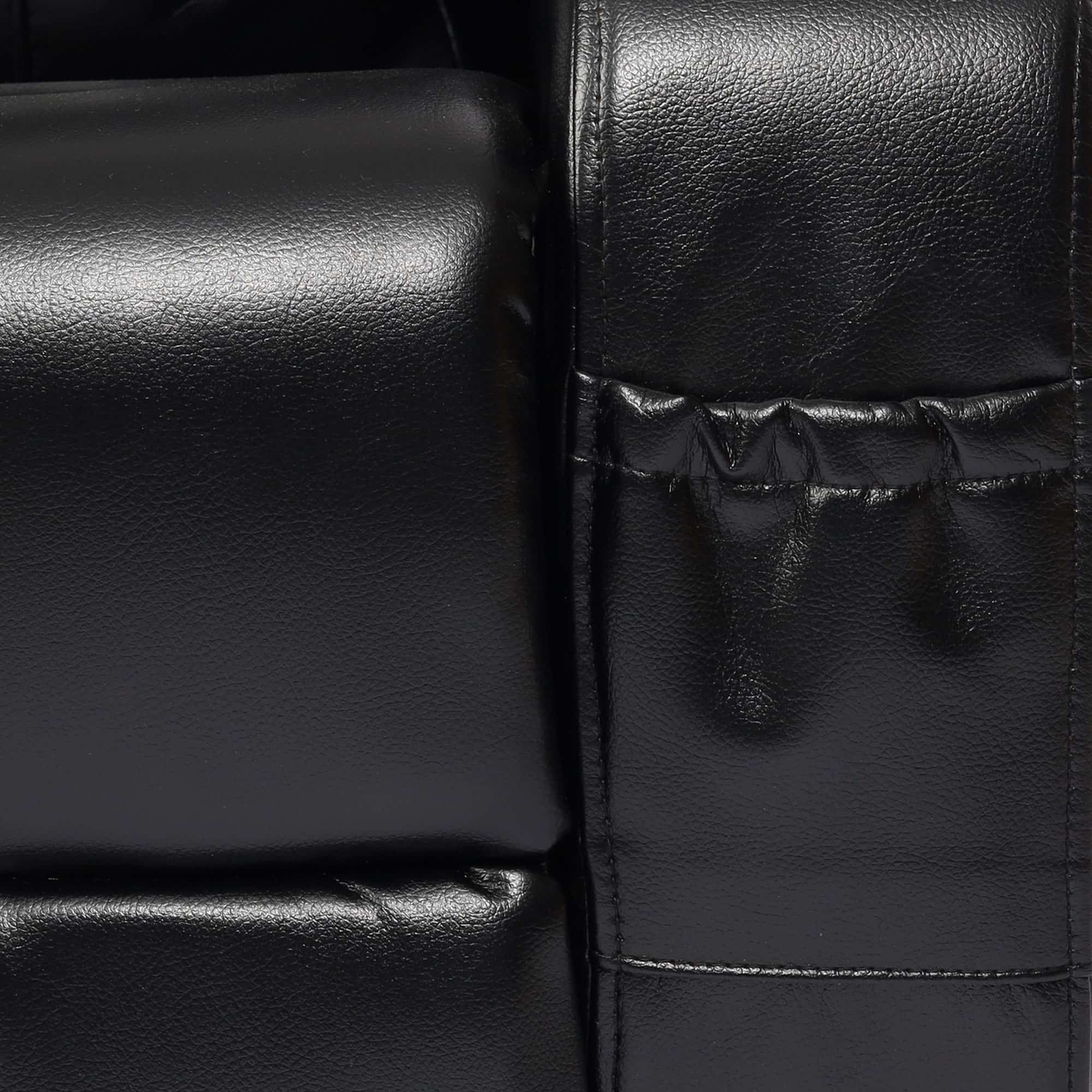Close-up of black leather Sofa Recliner with visible stitching